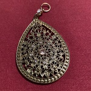 Vintage pendant with two cubic zirconia in teardrop lattice.